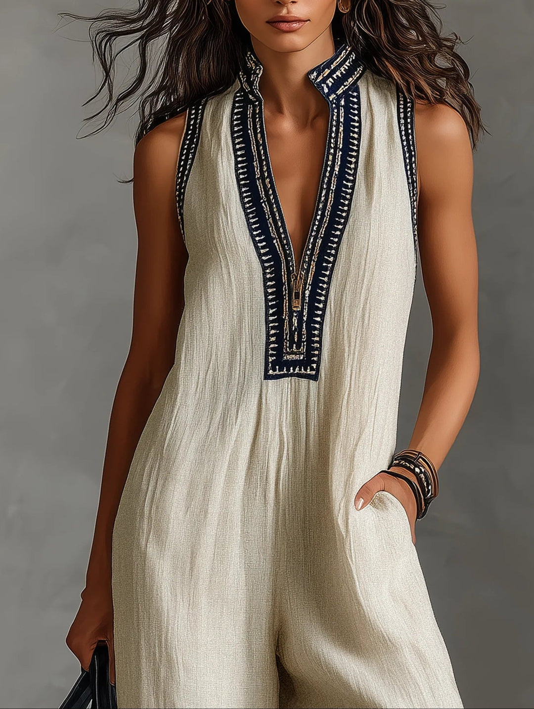 Fiamma - Mouwloze jumpsuit met minimalistische hoge kraag en rits