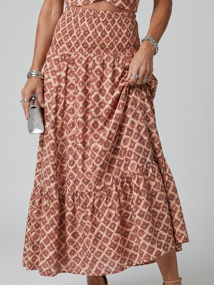 Ines | Midi-jurk met halternek en geometrisch patroon